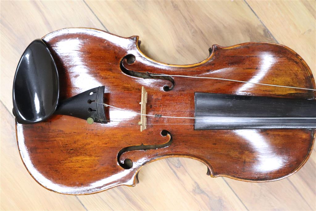 A 19th century Flemish? violin, length of back 35cm, cased with two bows